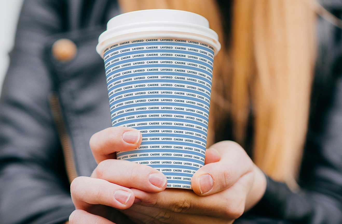 Coffee cup with customized pattern designed for Layered Cakerie by Studio Usher