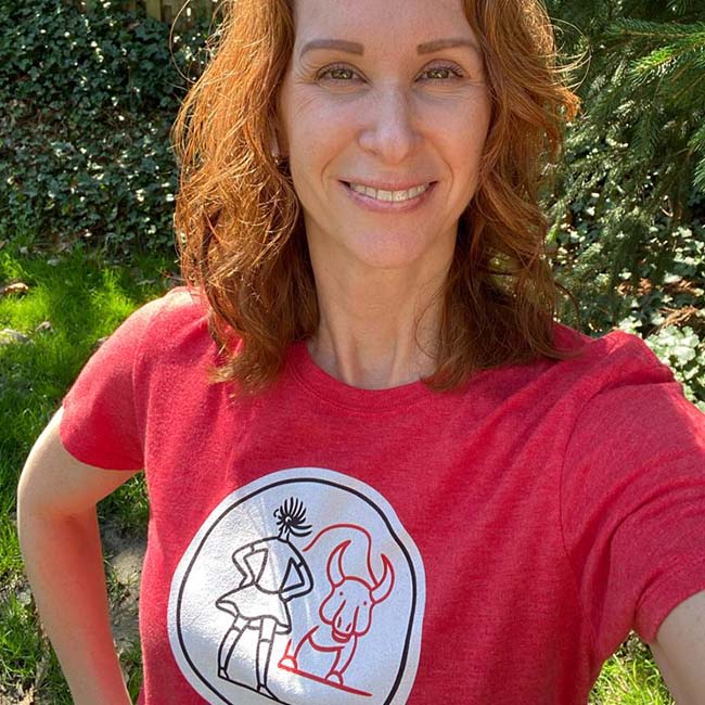 Woman wearing the iconic Fearless Girl T-shirt